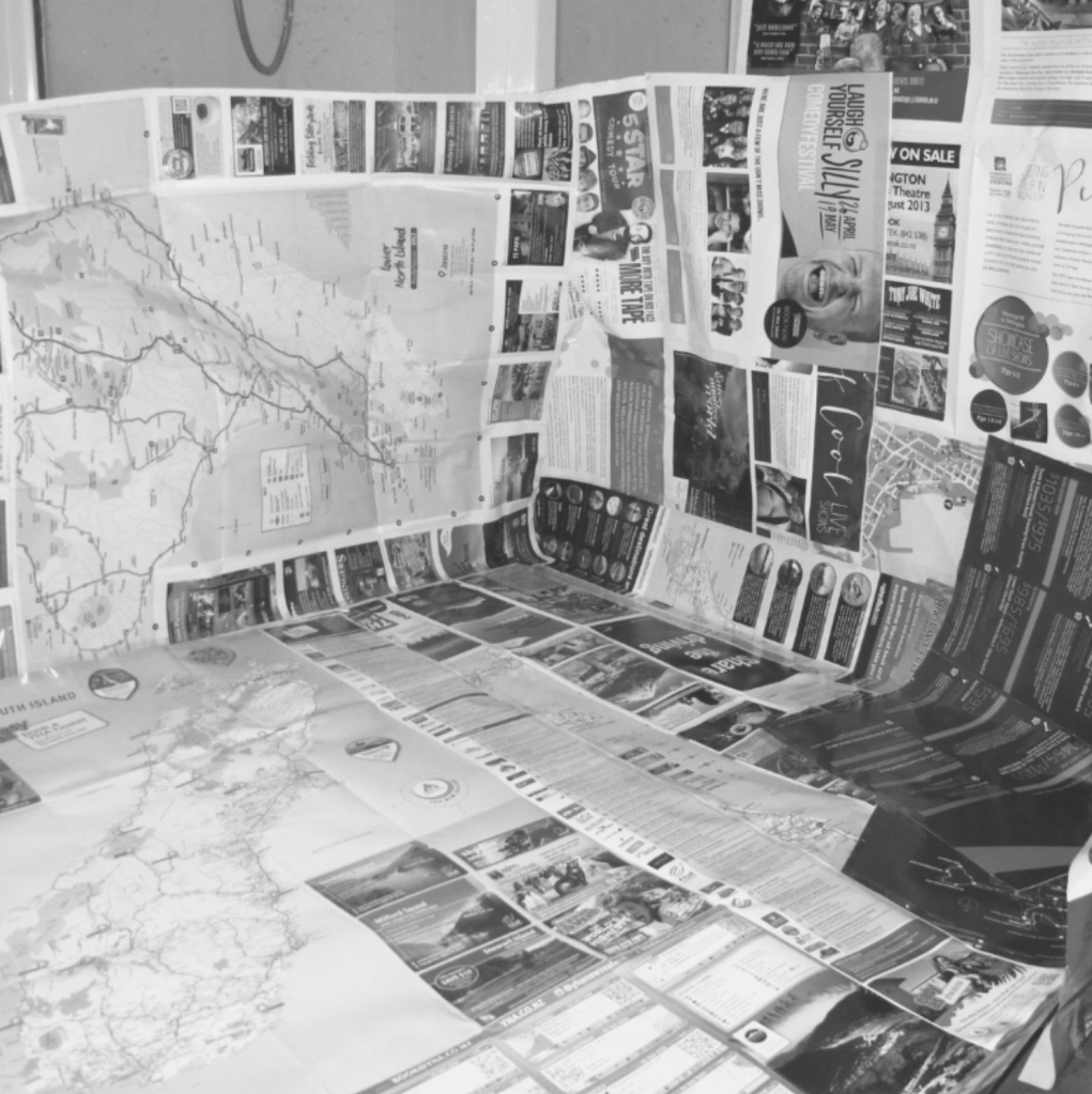 Newspaper positioned together to form a barrier to the wall, so that no mess will be made in the room.